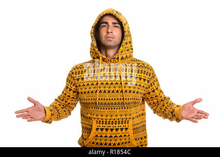 Portrait of young handsome Persian man wearing hoodie Stock Photo
