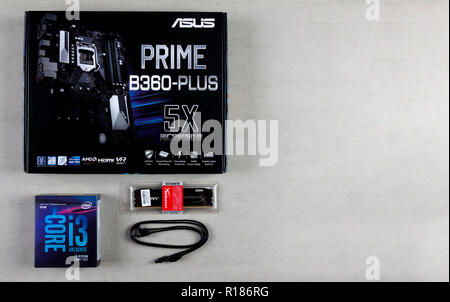 Maykop, Russia - November 9, 2018: Asus motherboard in box, processor intel I3, RAM Kingston Fury Hyper 16 GB and cable for connecting devices SATA 6G Stock Photo