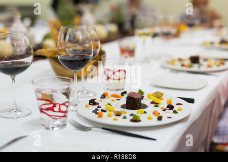 Luxury dinner with beef with red caviar and ginger croutons and vegetables Stock Photo