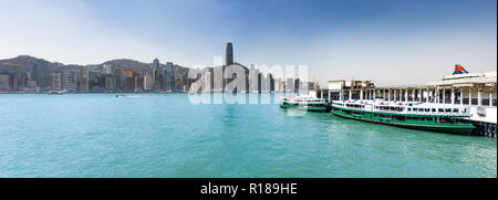 Panoramic view of Hong Kong City. Ferry terminal on the foreground. Skyline Panorama Stock Photo