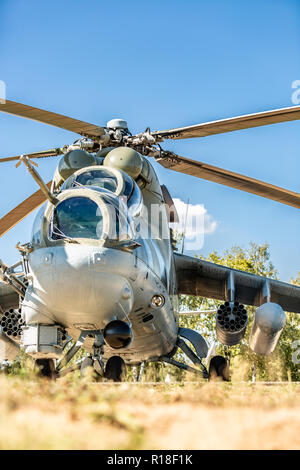 Military helicopter lands on the ground during Military Exercise Stock Photo