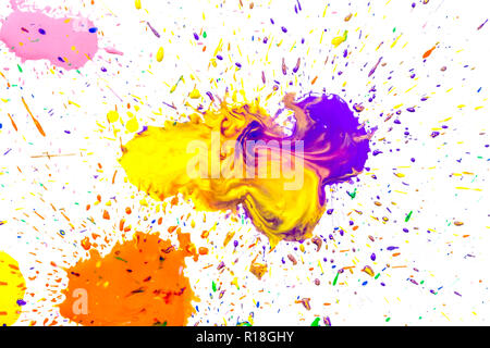 Multicolored watercolor blots isolated on white background. Splashes of a multicolored watercolor paint drops on a white background. Stock Photo