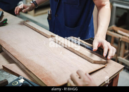 Thai engineer student in carpentry workshop Stock Photo