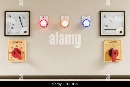 High voltage electricity control box with voltage and current meter, knob switch and indicator for all three phases of electricity Stock Photo