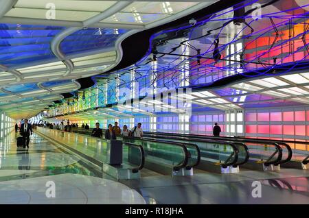 Chicago, Illinois, USA. The colorfully appointed tunnel passageway connecting two United Airlines terminals at O'Hare International Airport. Stock Photo