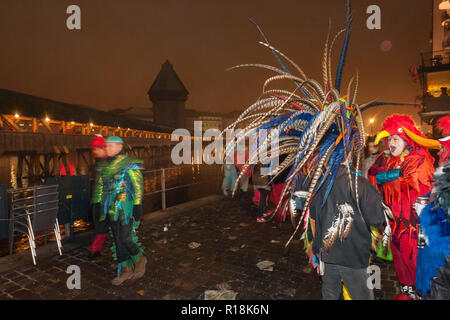 people wearing a costumes of funny exotic birds at Luzern Carnival, Switzerland Stock Photo