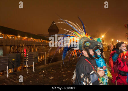 people wearing a costumes of funny exotic birds at Luzern Carnival, Switzerland Stock Photo