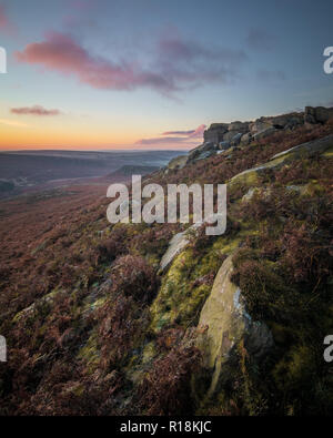 Heather and Bracken on a rocky gritstone edge in autumn / fall in the UK's picturesque Peak District Stock Photo
