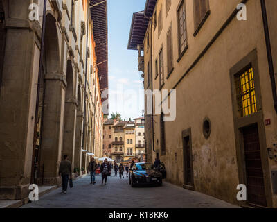 Looking towards medieval Piazza Grande in the City of Arezzo, Tuscany, Italy Stock Photo