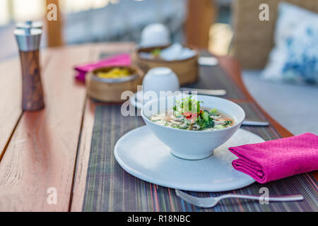 Outdoors restaurant scene, table set-up delicious breakfast for two at the luxury hotel Stock Photo