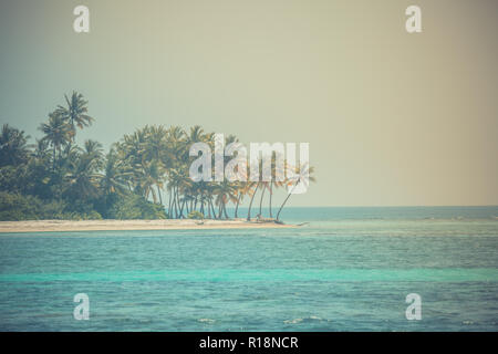 Vintage toned beach landscape. Tranquil beach scene. Exotic tropical beach resort, landscape for background or wallpaper. Design of summer vacation Stock Photo