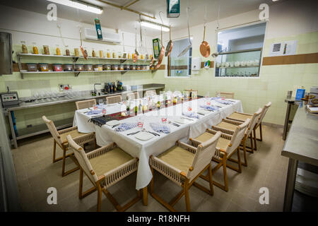 Table set up for dinner, interior of kitchen made for special dinners. Private restaurant room, scene Stock Photo