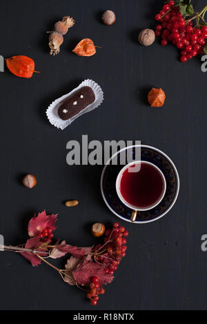 autumn background breakfast cake yellow and leaves of berries fruits nuts Stock Photo