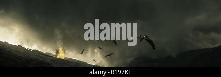 birds flying away from stormy clouds and bonfire in the high mountains Stock Photo