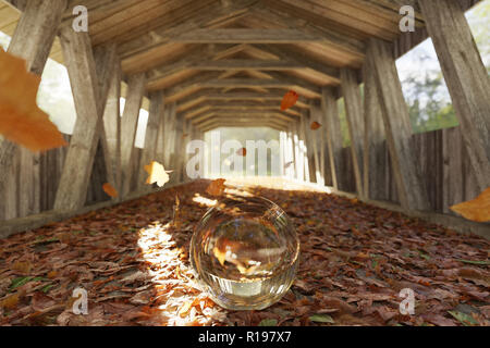 3d rendering of crystal ball on colourful leaves at old covered wooden bridge Stock Photo
