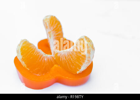 orange sliced pepper and mandarin top view isolated on white background Stock Photo