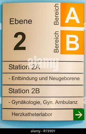 Sign indicating different departments as new born and heart station at a hospital Stock Photo