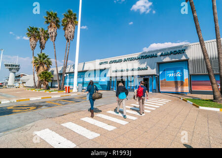 tourists arriving at the entrance from landing strip, windhoek airport, Hosea Kutako international airport, Namibia Stock Photo