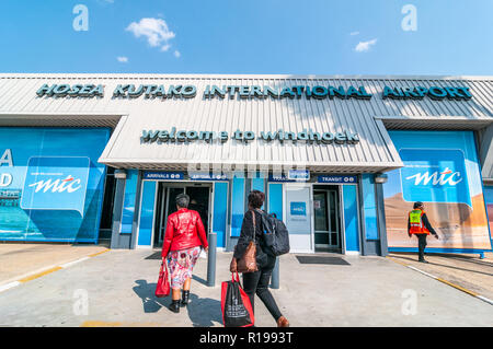 tourists arriving at the entrance from landing strip, windhoek airport, Hosea Kutako international airport, Namibia Stock Photo