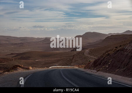 Road from Todgha Gorge near Tinghir city in Morocco. Desert landscape at background. Stock Photo