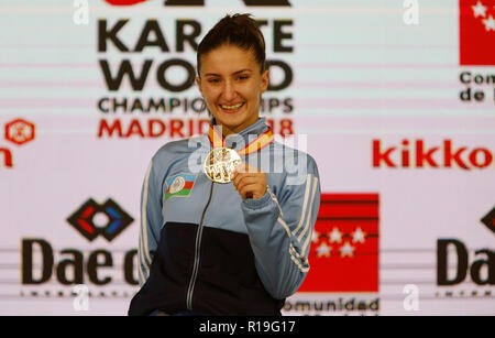 Azerbaijani karateka Irina Zaretska seen celebrating with her gold medal on the podium of the 24th Karate World Championships at the WiZink centre in Madrid. Stock Photo