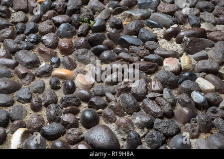 paving stone gray background, round granite and basalt paving stones background old and antique paved street Stock Photo