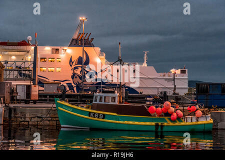 Northlink Ferry & fishing boat at dusk, Stromness, Orkney Stock Photo