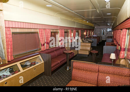 Window blinds drawn in the 1st class lounge/ bar carriage as The Ghan Train travels through the outback at night.  The Ghan takes its name from the 19 Stock Photo