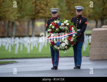 Belleau Wood, France. 10th Nov, 2018. U.S Marines place a wreath during a ceremony at the Aisne - Marne American Cemetery near the World War One battle ground of Belleau Wood November 10, 2018 in Belleau, France. President Donald Trump was scheduled to attend the ceremony but cancelled due to inclement weather. Credit: Planetpix/Alamy Live News Stock Photo