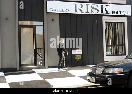 New York City, New York, USA. 10th Nov, 2018. A stretch of a Brooklyn, New York sidewalk, has been transformed into a checkerboard of black and white squares across a patch of pavement outside a fancy new apartment building and store RISK Boutique and Gallery in the rapidly gentrified neighborhood of Bushwick. The Department of Transportation says people cannot legally paint sidewalks and unauthorized artistry typically receives a fine, with property owners usually get 30 days to remove their work before an official penalty follows. Credit: G. Ronald Lopez/ZUMA Wire/Alamy Live News Stock Photo