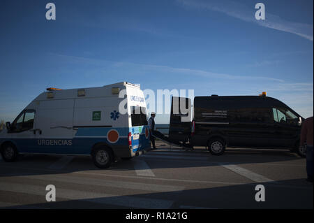 Malaga, MALAGA, Spain. 10th Nov, 2018. (EDITOR'S NOTE: IMAGE DEPICTS DEATH).A corpse of a migrant seen carried into a mortuary van after arriving on the beach on a dinghy with a group of migrants.A dinghy with migrants and two dead arrived at the Chilches beach near the coast of Velez MÃ¡laga, in Malaga. According to the media and witnesses, some of the migrants from Morocco escaped at the beach while the two corpses were found inside the small boat. Credit: Jesus Merida/SOPA Images/ZUMA Wire/Alamy Live News Stock Photo