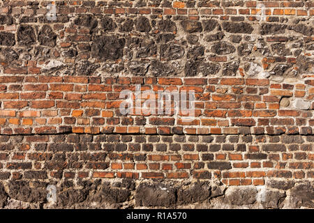 Brick and stone old wall background of 15th century Corpus Christi Basilica in Krakow, Poland Stock Photo