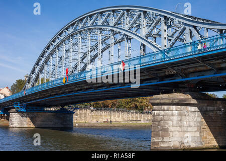 Jozef Pilsudski Bridge on Vistula river in Krakow, Poland, iron truss bridge from 1933. Stock Photo