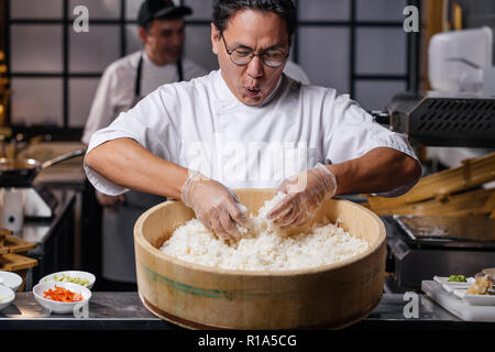 young emotional man is happy to prepare rice. Stock Photo