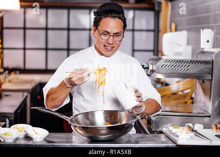 professional talented man male holding noodle Stock Photo