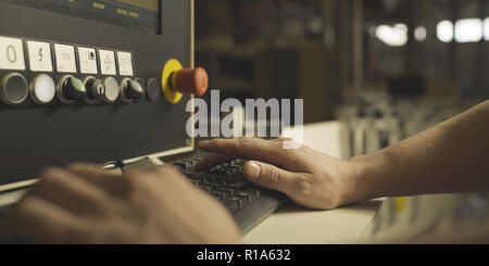 Factory Engineer Operating Hydraulic Tube Bender Stock Photo
