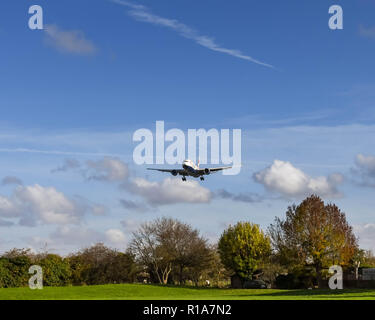 LONDON, ENGLAND - NOVEMBER 2018: British Airways Boeing 777 long haul airliner on final approach for landing landing at London Heathrow Airport. Stock Photo
