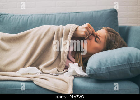 Woman having pain in sinus and fever. Stock Photo