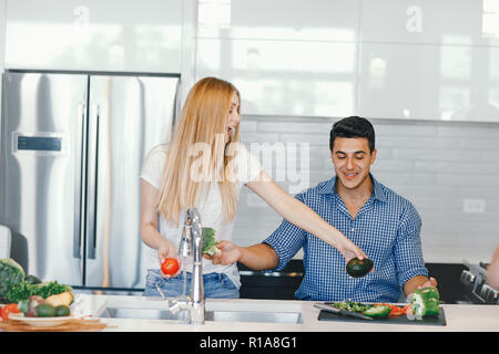 couple at home in a kitchen Stock Photo