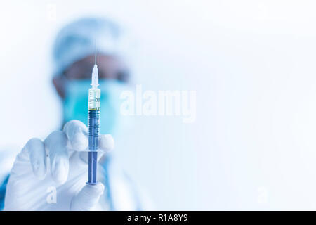Doctor with Syringe ready to take injection, Hospital Treatment Concept Stock Photo