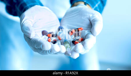 Doctor Glove hand with Syringe and medicines, Hospital Concept background Stock Photo
