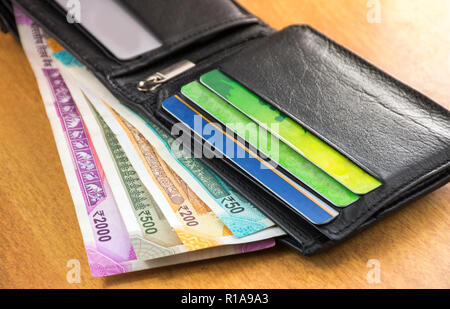 indian currency with purse two thousand and five hundred rupees credit debit card save money new currency r1a9a3