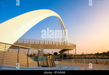 evening shot of Dubai Water Canal Bridge New Attraction of Dubai City Stock Photo