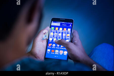 Closeup Shot of young men using smart phone, mobile addiction concept Stock Photo