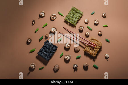 Deconstructed ramen illustrated by the ingredients used to create it. Photographed with direct light. Stock Photo