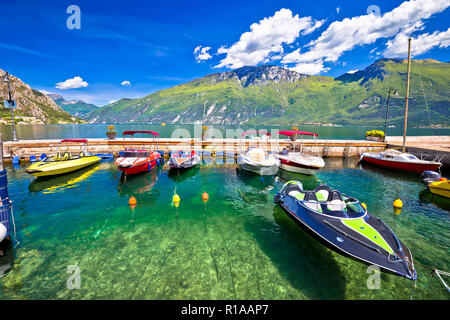 Speed boats on colorful Lago di Garda lake view, Limone sul Garda, Lombardy, Italy