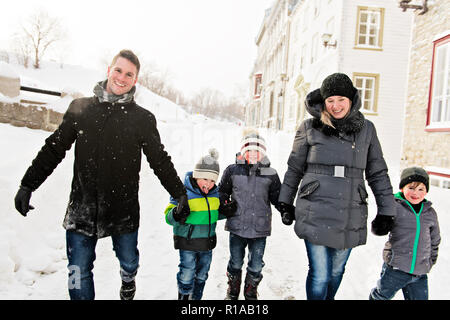 A nice family in winter season having fun Stock Photo