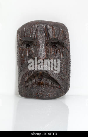 Carved Wooden Figurative Mask Stock Photo