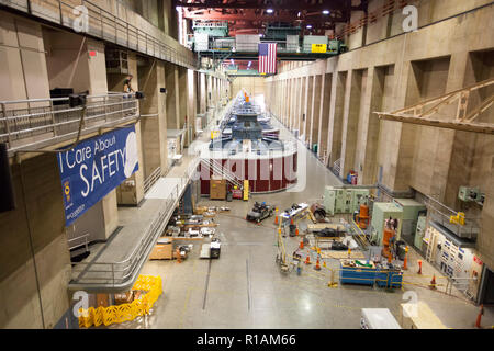 Inside the powerplant at hoover dam. The electro-magnetic turbines that generate power are in the center of the plant. Stock Photo
