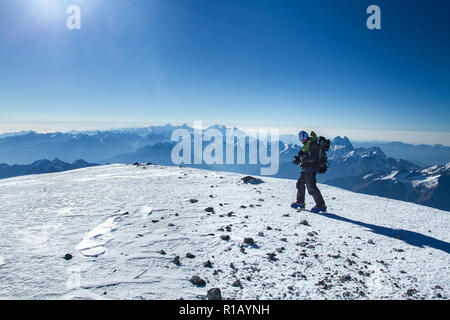 A man stands on top of Mount Elbrus Stock Photo